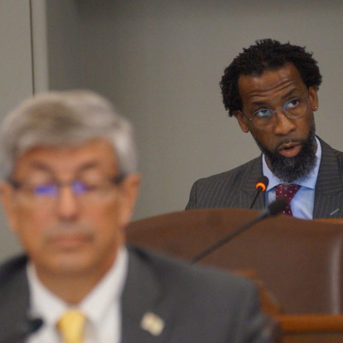 Rep. Curtis Tarver, D-Chicago, back, speaks during the first hearing of the House Special Investigating Committee into Rep. Carol Ammons, D-Urbana, on Thursday, Aug. 6, 2026. (Capitol News Illinois photo by Peter Hancock)
