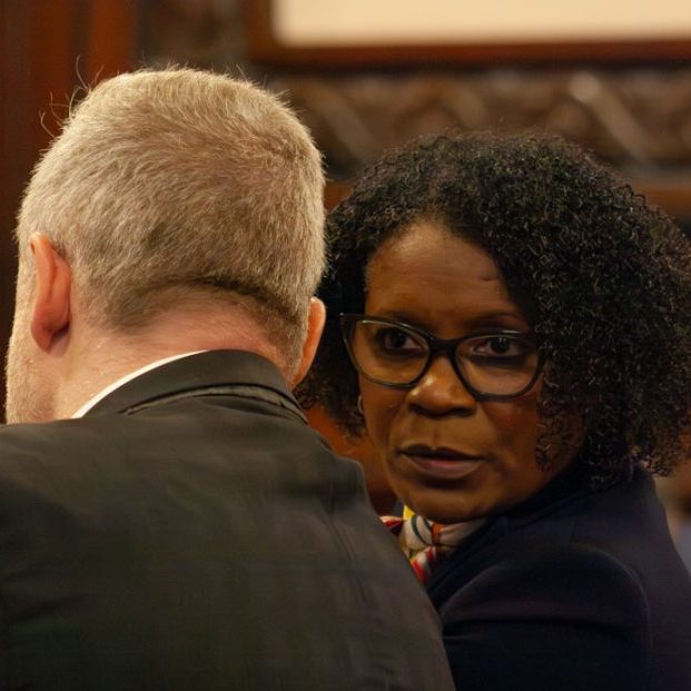 State Sen. Adriene Johnson talks to Planned Parenthood Illinois Action lobbyist Michael Zirir during a Senate committee hearing on Wednesday, April 29, 2026. (Capitol News Illinois photo by Jenna Schweikert)